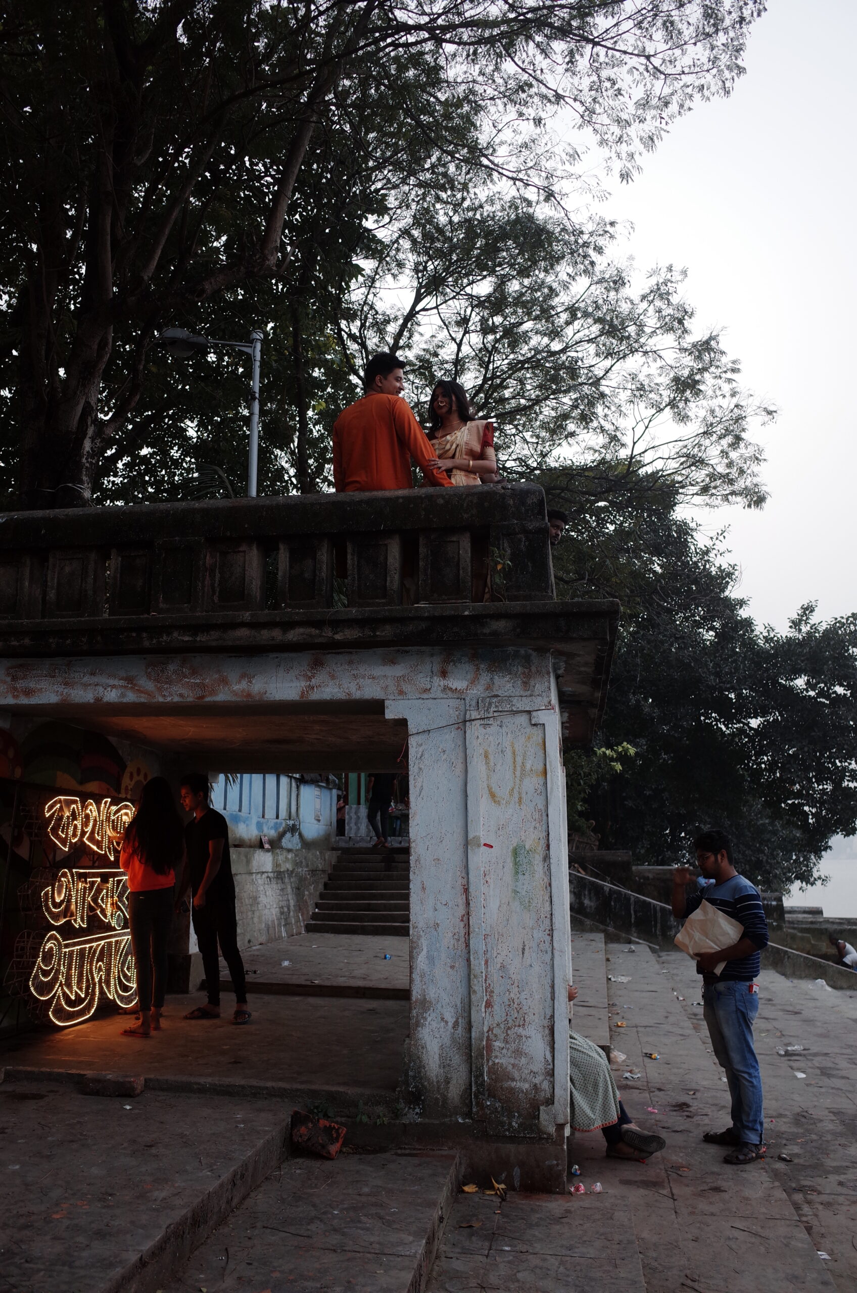 outdoor scene of art installation and a couple on the roof