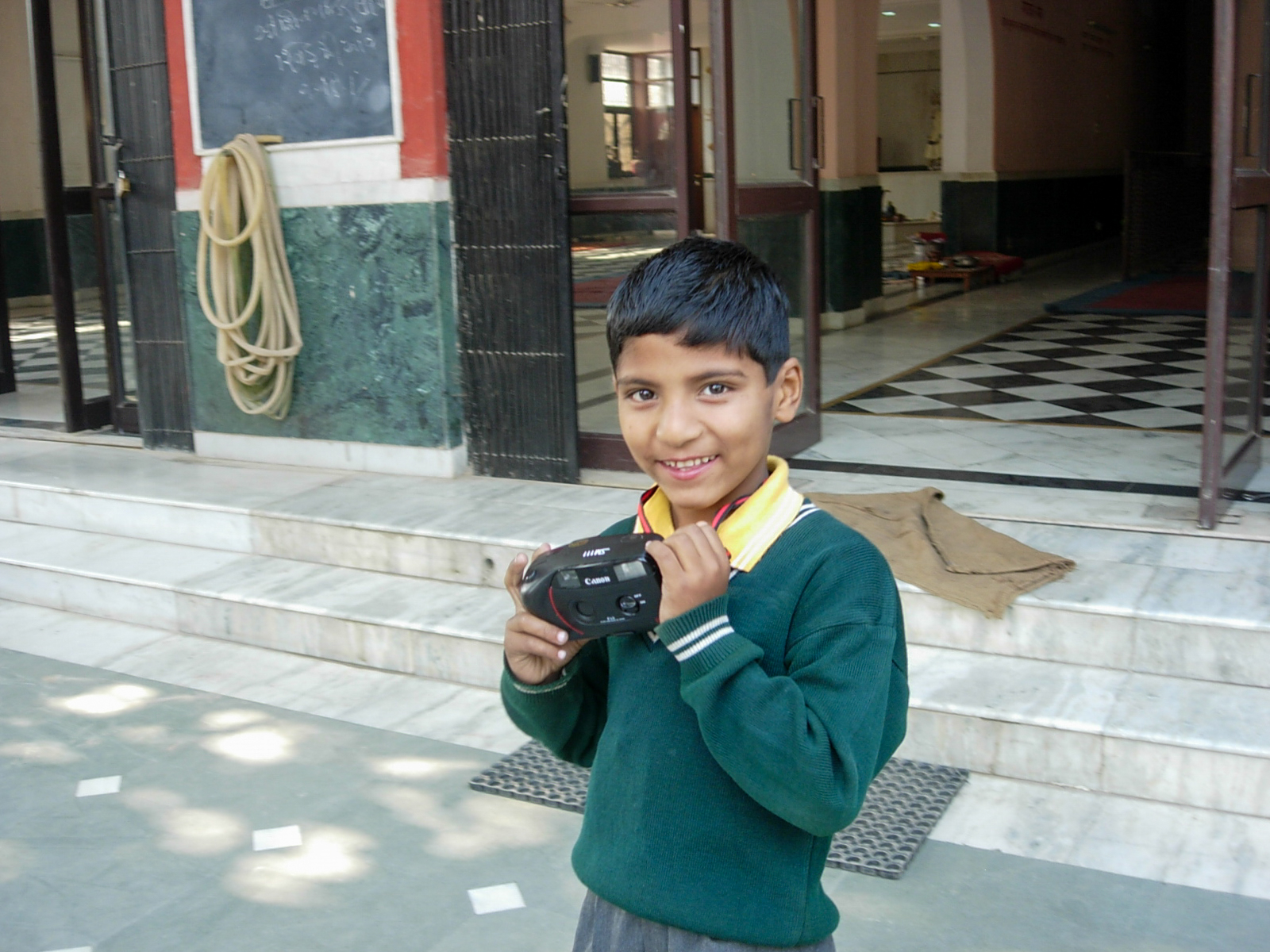 A child holding a camera.